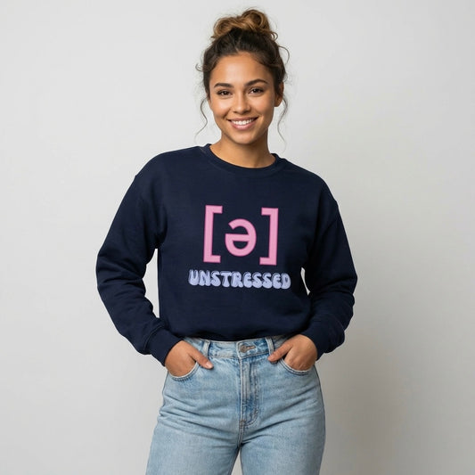 Model wearing a navy “Unstressed Schwa [ə]” speech therapy crewneck sweatshirt on a neutral background